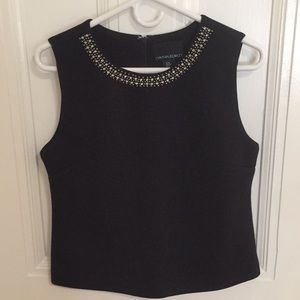 Structured black top with embellished collar